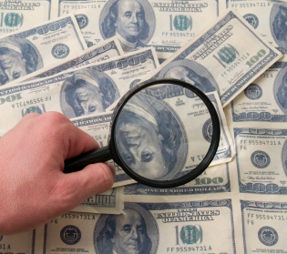 american hundred dollars fallse maney lookted in between magnify